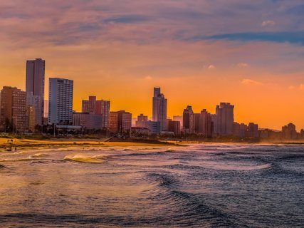 Durban golden mile beach with white sand and skyline South Africa